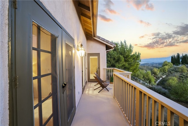 balcony at dusk with a mountain view