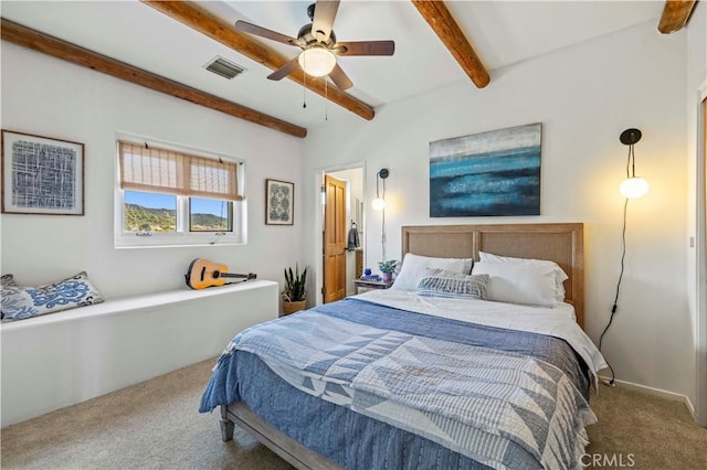 carpeted bedroom featuring visible vents, beamed ceiling, and ceiling fan