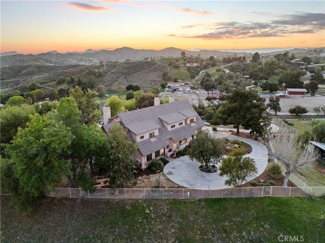 aerial view at dusk with a mountain view