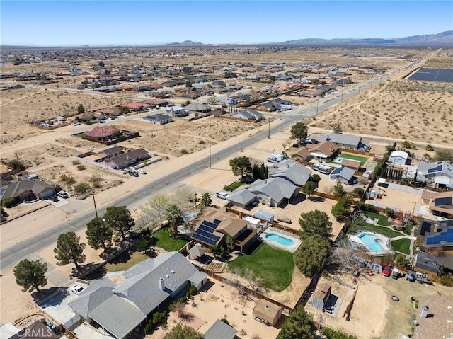 drone / aerial view with a mountain view and view of desert