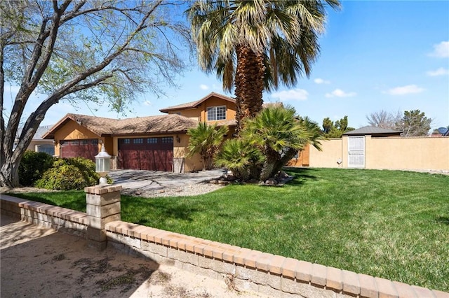 view of front facade with stucco siding, driveway, a garage, and a front lawn