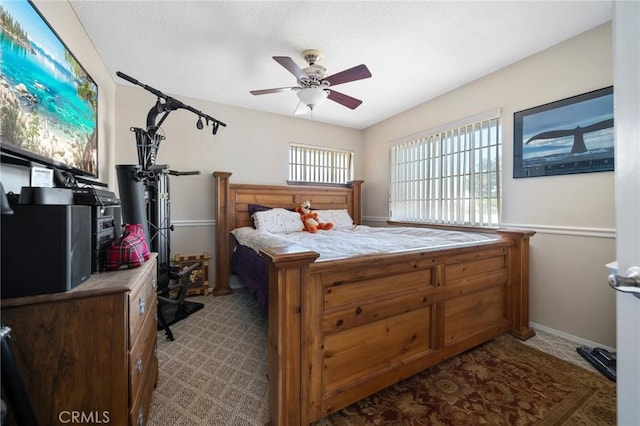 carpeted bedroom with a ceiling fan
