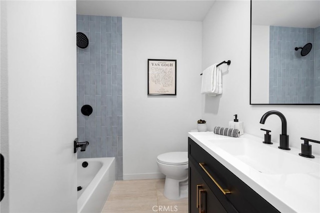 bathroom with vanity, tub / shower combination, toilet, baseboards, and tile patterned floors