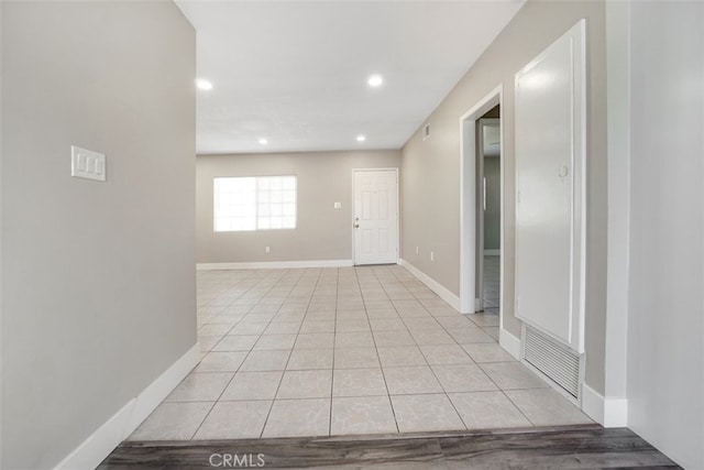 unfurnished room with light tile patterned floors, visible vents, recessed lighting, and baseboards