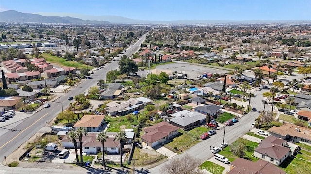 birds eye view of property with a residential view and a mountain view