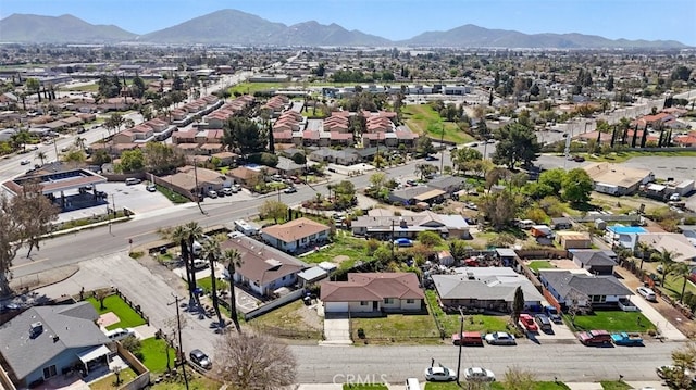 birds eye view of property featuring a mountain view and a residential view