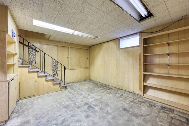 below grade area with stairway and wood walls