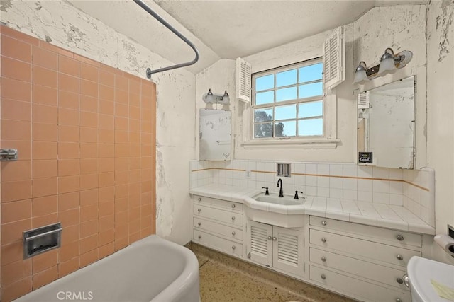 bathroom featuring backsplash, vanity, and toilet