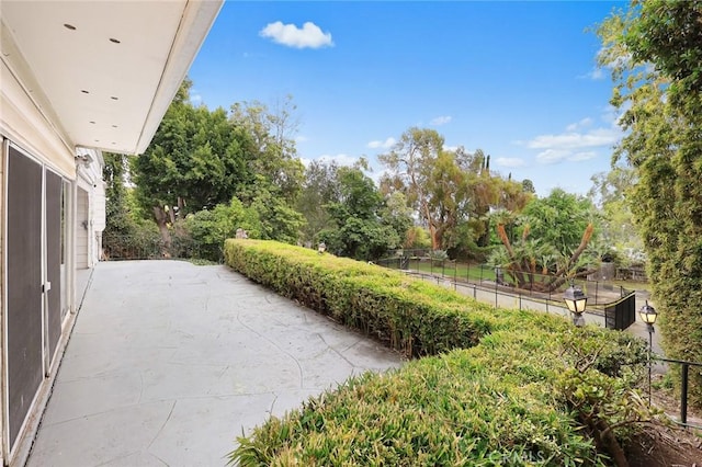 view of yard with a patio and fence