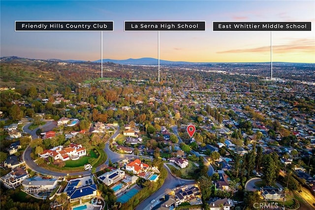 birds eye view of property featuring a mountain view