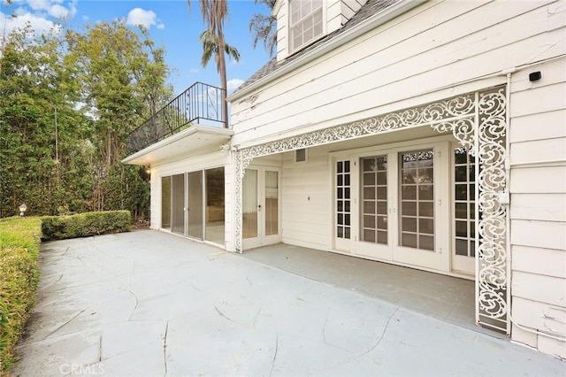 view of patio featuring a balcony