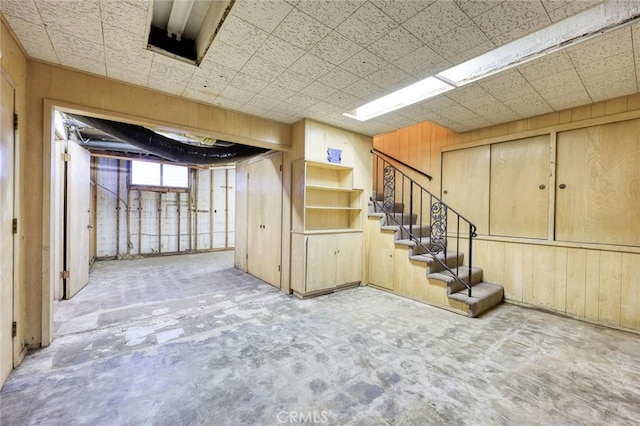 below grade area with stairway and wooden walls