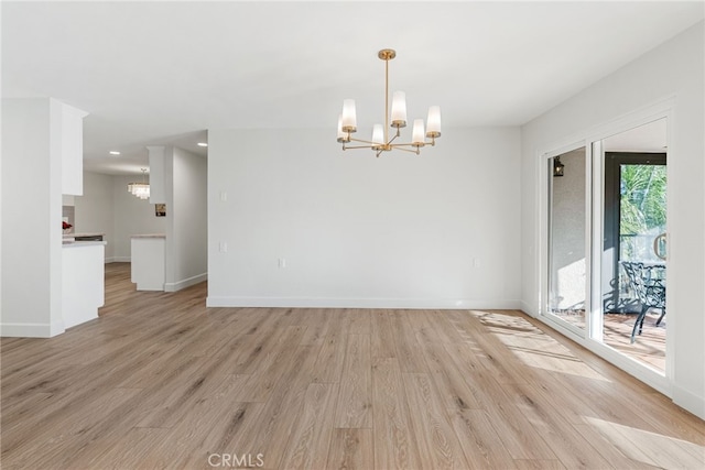 2392 Via Mariposa W Unit 3D, Laguna Woods, CA 92637 - unfurnished dining area with a chandelier, light wood finished floors, baseboards, and recessed lighting