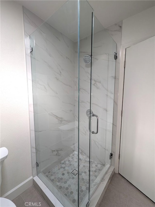 2392 Via Mariposa W Unit 3D, Laguna Woods, CA 92637 - full bathroom with toilet and a marble finish shower