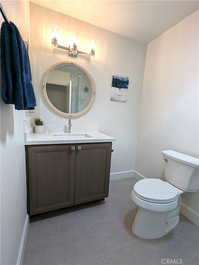 2392 Via Mariposa W Unit 3D, Laguna Woods, CA 92637 - bathroom with baseboards, toilet, tile patterned flooring, and vanity