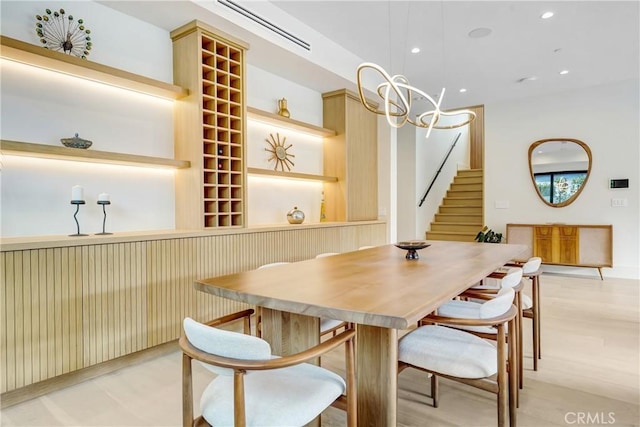 4949 Petit Ave, Encino, CA 91436 - dining area with recessed lighting, a notable chandelier, and stairs