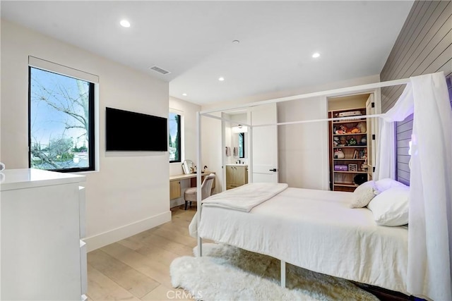 4949 Petit Ave, Encino, CA 91436 - bedroom with recessed lighting, visible vents, ensuite bathroom, and light wood-type flooring