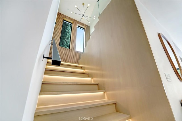 4949 Petit Ave, Encino, CA 91436 - stairway featuring a notable chandelier and a high ceiling