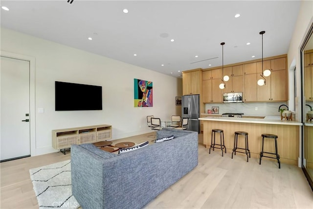 4949 Petit Ave, Encino, CA 91436 - living room featuring recessed lighting and light wood-style floors
