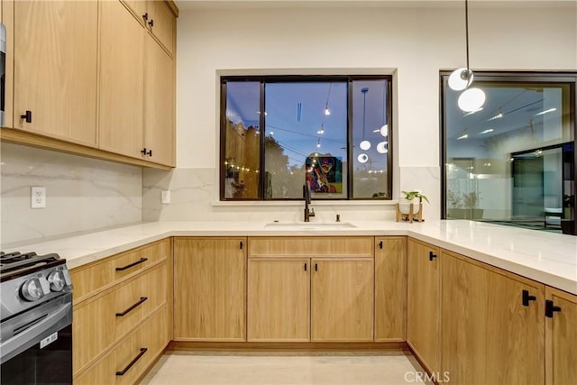 4949 Petit Ave, Encino, CA 91436 - kitchen featuring light brown cabinets, light stone countertops, a sink, decorative backsplash, and gas range