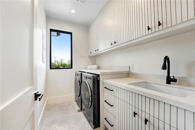 4949 Petit Ave, Encino, CA 91436 - laundry area with baseboards, washing machine and clothes dryer, recessed lighting, cabinet space, and a sink