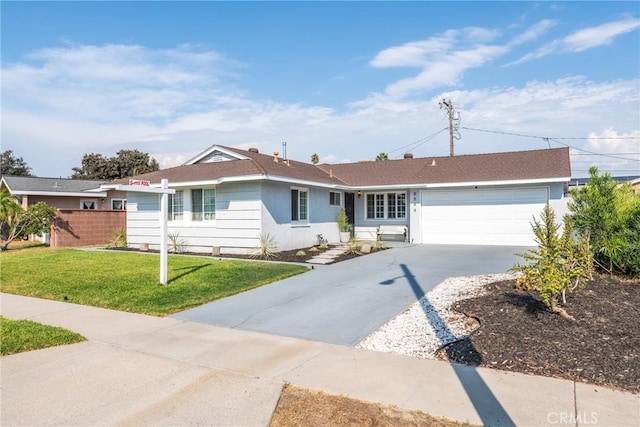 single story home featuring stucco siding, driveway, fence, a front yard, and a garage