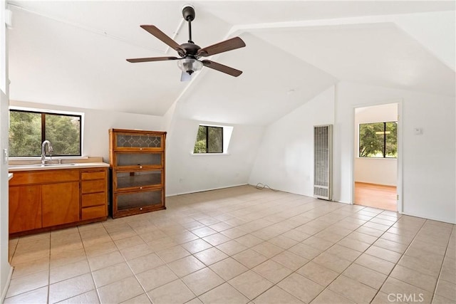 13155 San Antonio Rd, Atascadero, CA 93422 - unfurnished living room with a heating unit, vaulted ceiling, plenty of natural light, ceiling fan, and light tile patterned flooring