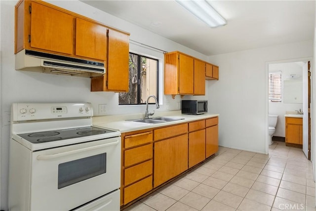 13155 San Antonio Rd, Atascadero, CA 93422 - kitchen featuring white electric stove, under cabinet range hood, a sink, and light countertops
