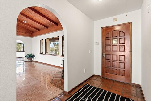 13155 San Antonio Rd, Atascadero, CA 93422 - entrance foyer featuring wooden ceiling, arched walkways, baseboards, and tile patterned flooring