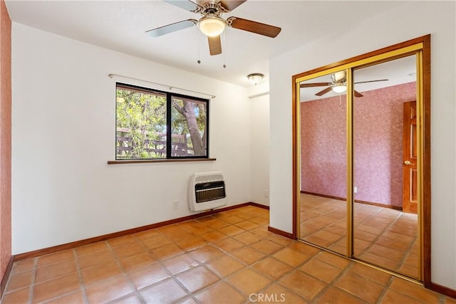 13155 San Antonio Rd, Atascadero, CA 93422 - unfurnished bedroom featuring heating unit, tile patterned flooring, a closet, ceiling fan, and baseboards