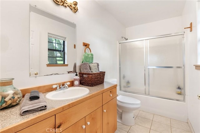 13155 San Antonio Rd, Atascadero, CA 93422 - bathroom with tile patterned floors, vanity, toilet, and combined bath / shower with glass door