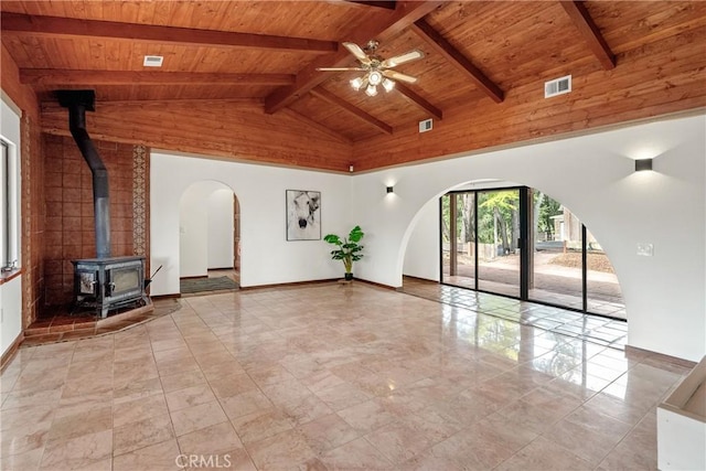 13155 San Antonio Rd, Atascadero, CA 93422 - unfurnished living room with wood ceiling, a wood stove, a ceiling fan, high vaulted ceiling, and beam ceiling