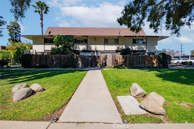 1935 Royalty Dr, Pomona, CA 91767 - exterior space featuring a fenced front yard