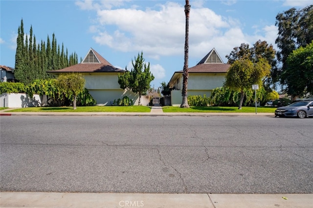 1935 Royalty Dr, Pomona, CA 91767 - view of front of home with stucco siding