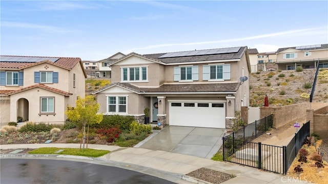 view of front of home with solar panels, stone siding, concrete driveway, an attached garage, and stucco siding