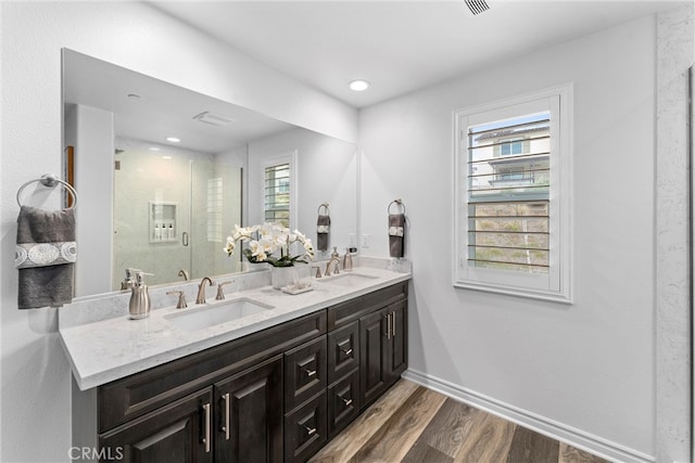 11636 Wandering Way, Corona, CA 92883 - full bath with wood finished floors, a shower stall, double vanity, baseboards, and recessed lighting