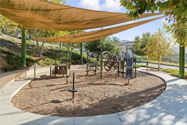 view of home's community featuring playground community