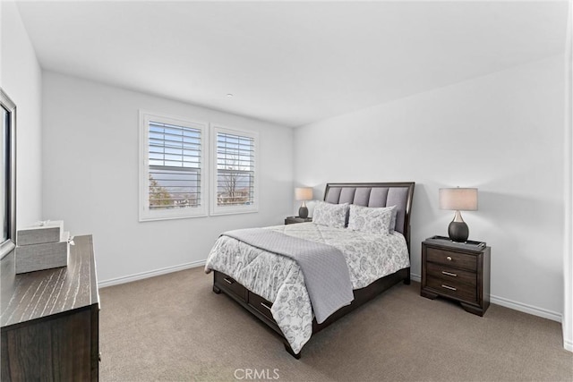 bedroom with baseboards and carpet flooring
