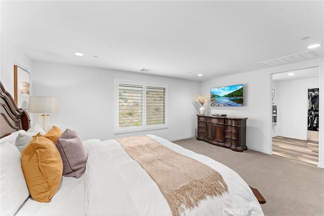 carpeted bedroom featuring visible vents and recessed lighting