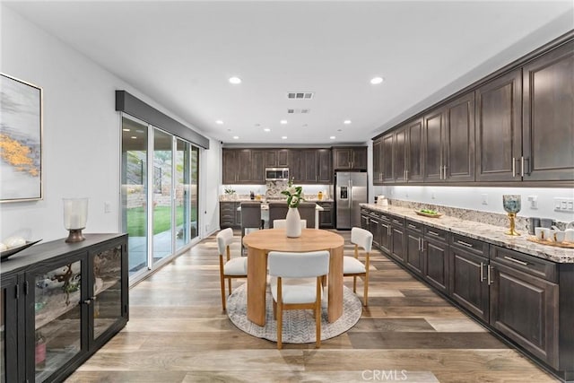 11636 Wandering Way, Corona, CA 92883 - dining space with recessed lighting and wood finished floors