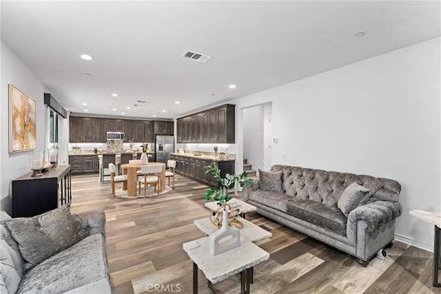 11636 Wandering Way, Corona, CA 92883 - living room featuring light wood-style floors and recessed lighting