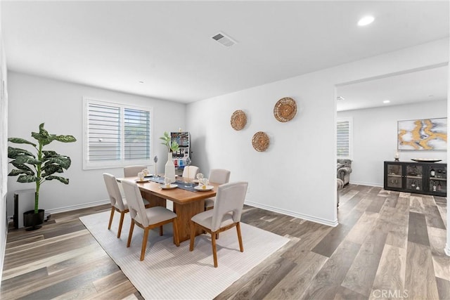 11636 Wandering Way, Corona, CA 92883 - dining area with healthy amount of natural light, wood finished floors, baseboards, and recessed lighting