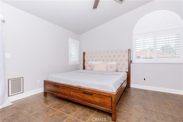 bedroom with baseboards, ceiling fan, tile patterned flooring, and lofted ceiling