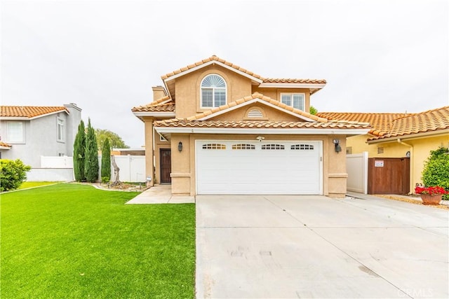 view of front of property with concrete driveway, fence, a front lawn, and stucco siding