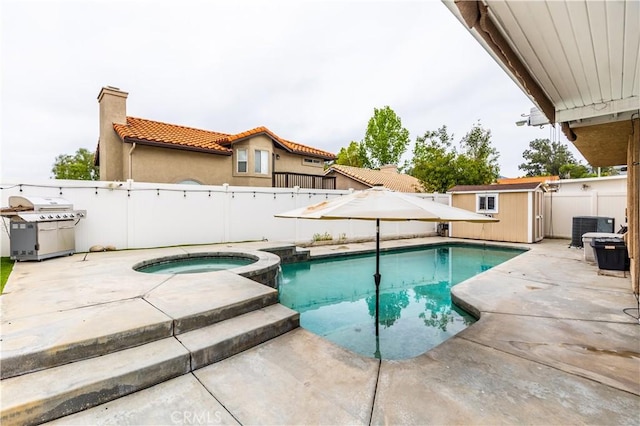 view of swimming pool featuring a fenced backyard, a patio area, a shed, and a grill