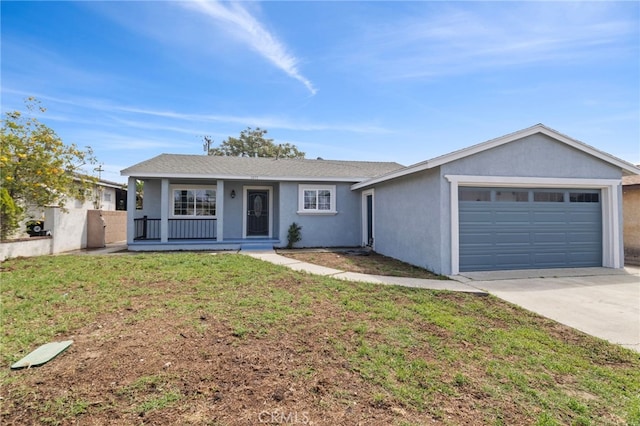 single story home featuring an attached garage, covered porch, concrete driveway, stucco siding, and a front lawn