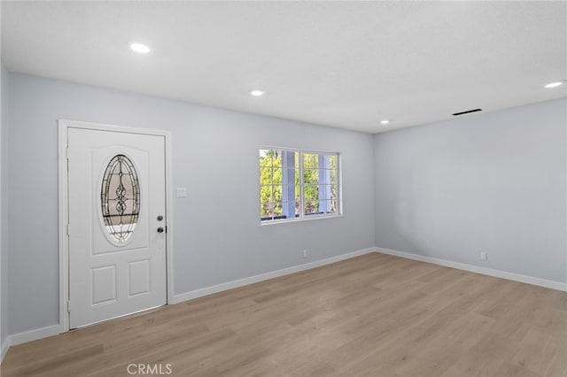 foyer featuring recessed lighting, visible vents, light wood-type flooring, and baseboards