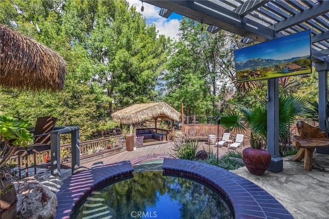 view of swimming pool featuring a pergola, a gazebo, and a deck