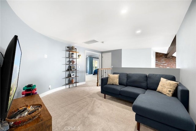 living room with visible vents, baseboards, and carpet floors
