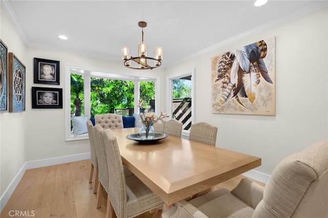 dining area featuring baseboards, a chandelier, recessed lighting, crown molding, and light wood-style floors